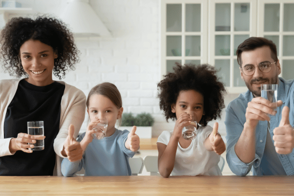 A family drinking clean, filtered water. 